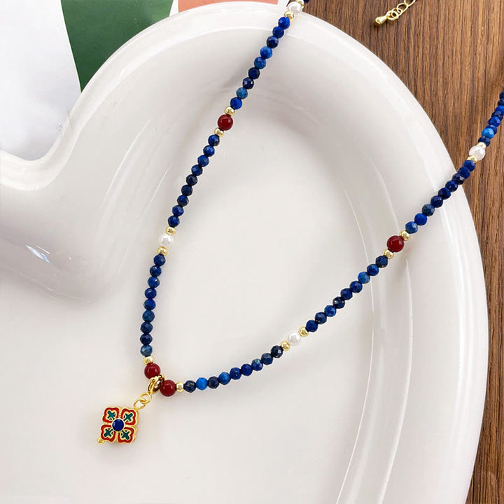 Lazurit Kette mit Buddha Perlen roten Steinen und goldenem Verschluss