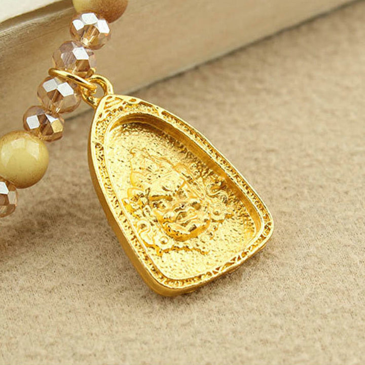 Tigerauge Kette mit goldenem Lotus Tibet Anhänger Rundplatte