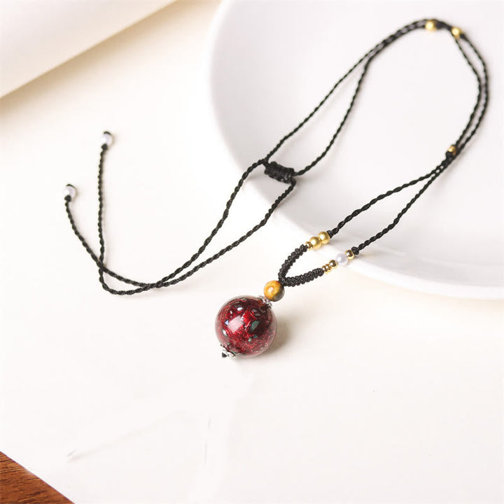 Ebenholz Kette mit Granat Kugel Anhänger goldenen Perlen schwarzes Schmuck