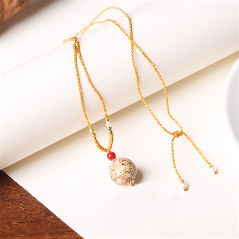 Goldene Kette Ebenholz Perlmutt Buddha Anhänger verzierter Stein