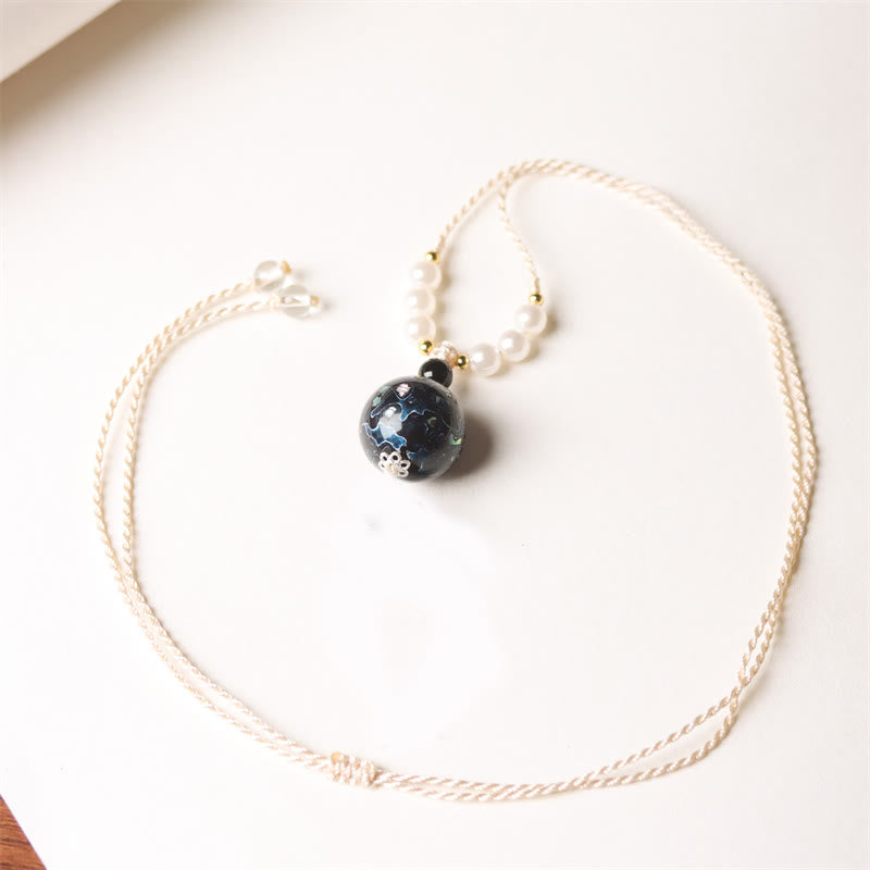 Schwarze Lapislazuli Kette mit Perlmutt Balance Buddha Anhänger