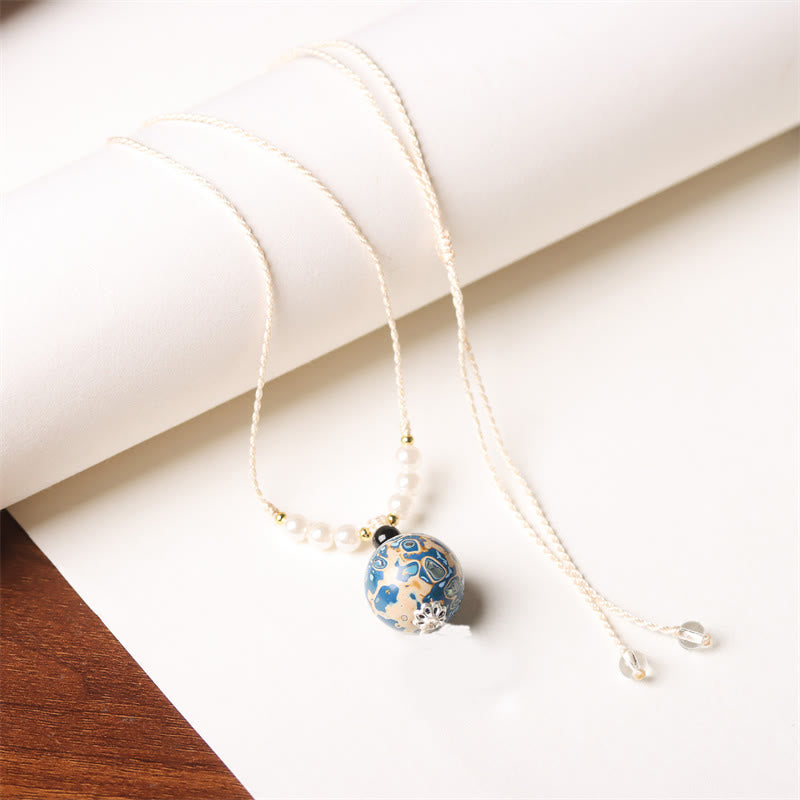 Weiße Perlmutt Kette mit Ebenholz Buddha Anhänger Balance