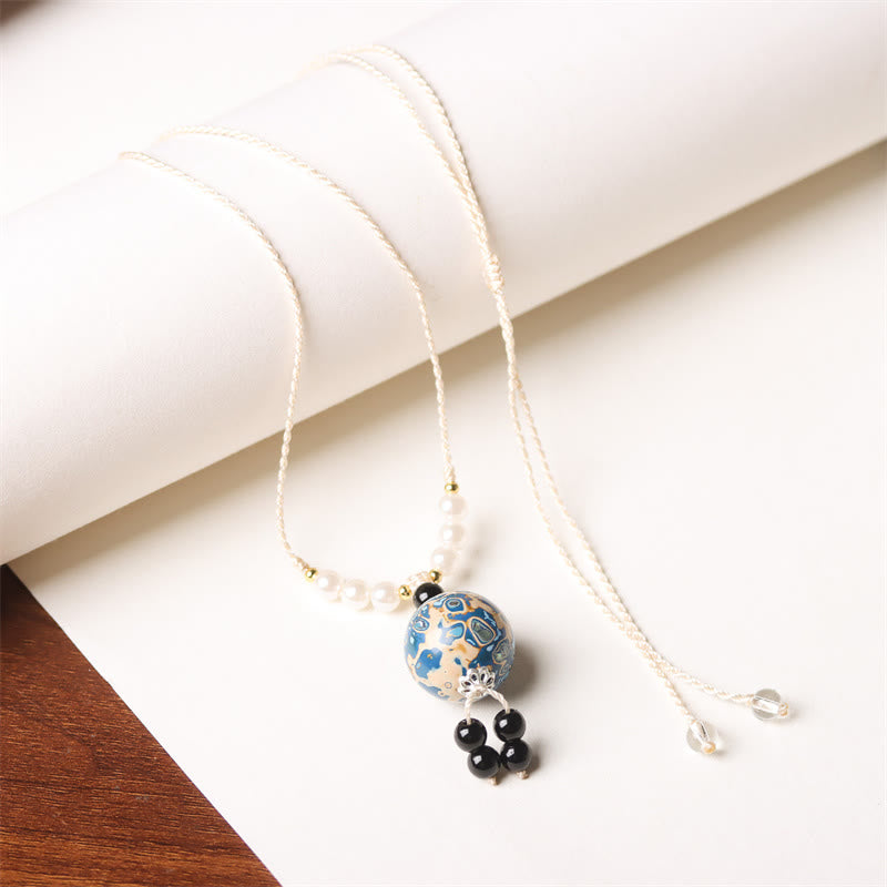Ebenholz Perlmutt Kette mit blauem Buddha-Anhänger Meditation Balance Schmuck