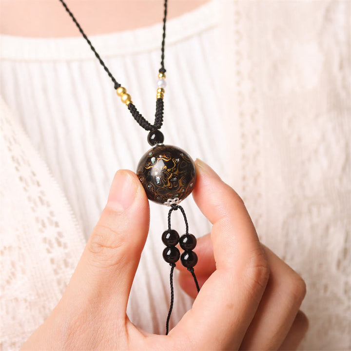 Ebenholz Buddha Kette Balance Anhänger schwarzer Naturstein mit Goldakzenten
