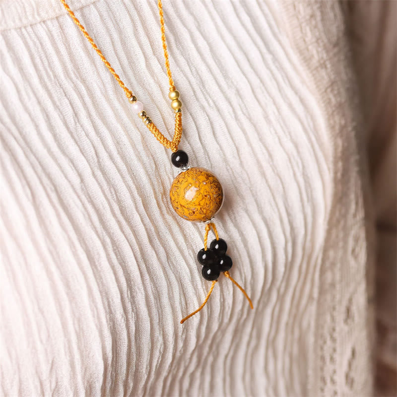 Ebenholz Perlmutt Buddha Balance Kette goldener Anhänger schwarze Perlen