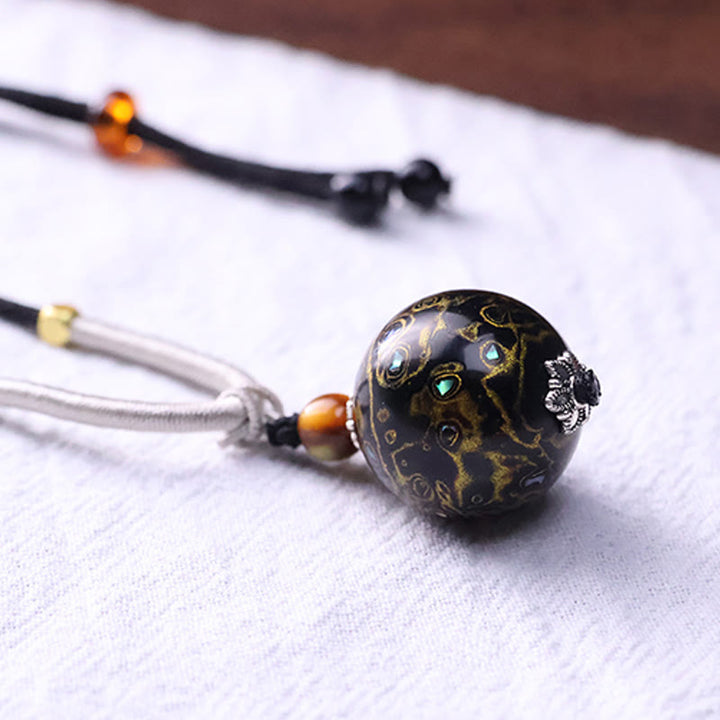 Schwarze Ebenholz Buddha Kette mit Gold Lack und Steinen