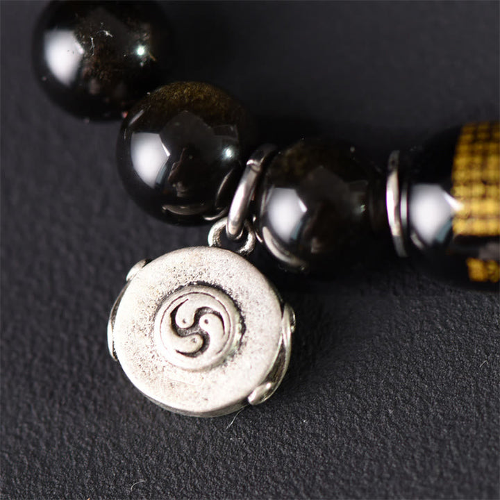 Armband Sandelholz Obsidian mit Spiralanhänger schwarze Perlen
