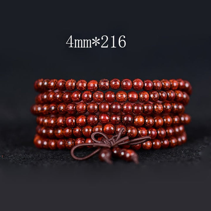 Sandelholz Armband Balance Wickelarmband rote Perlen Naturstein Nahaufnahme