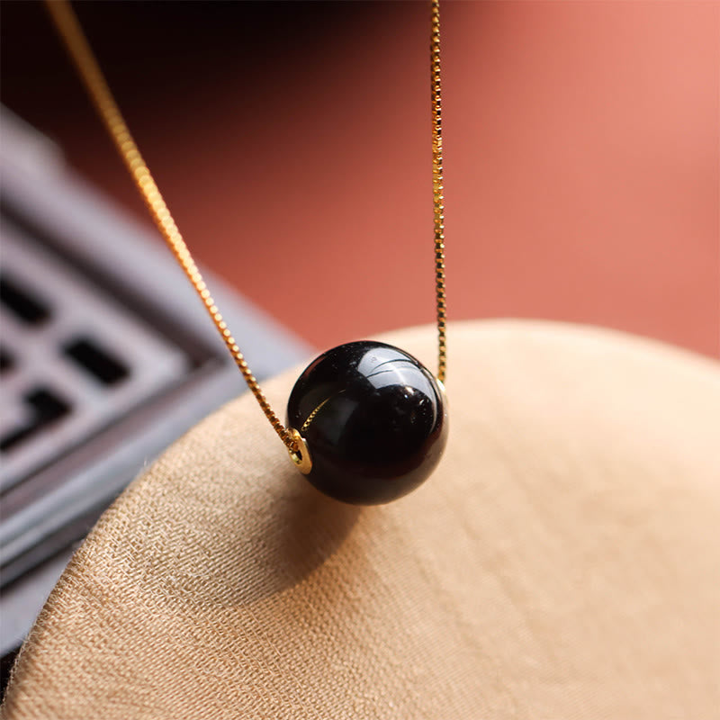 Schwarze Obsidian Kugelperle goldene Kette Bernstein Anhänger 925er Silber Naturstein