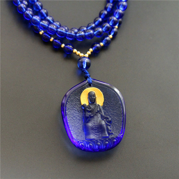 Blaue Kette aus Liuli-Kristall mit Ksitigarbha Bodhisattva Anhänger und Goldperlen