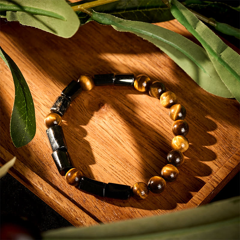Armband Tigerauge – Energie mit schwarzen Steinen und goldenen Perlen