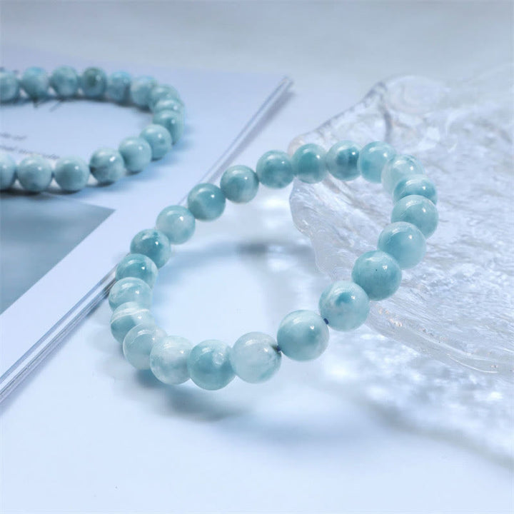 Larimar Armband Weisheit Selbstvertrauen hellblau Naturstein elastisch Perlen.