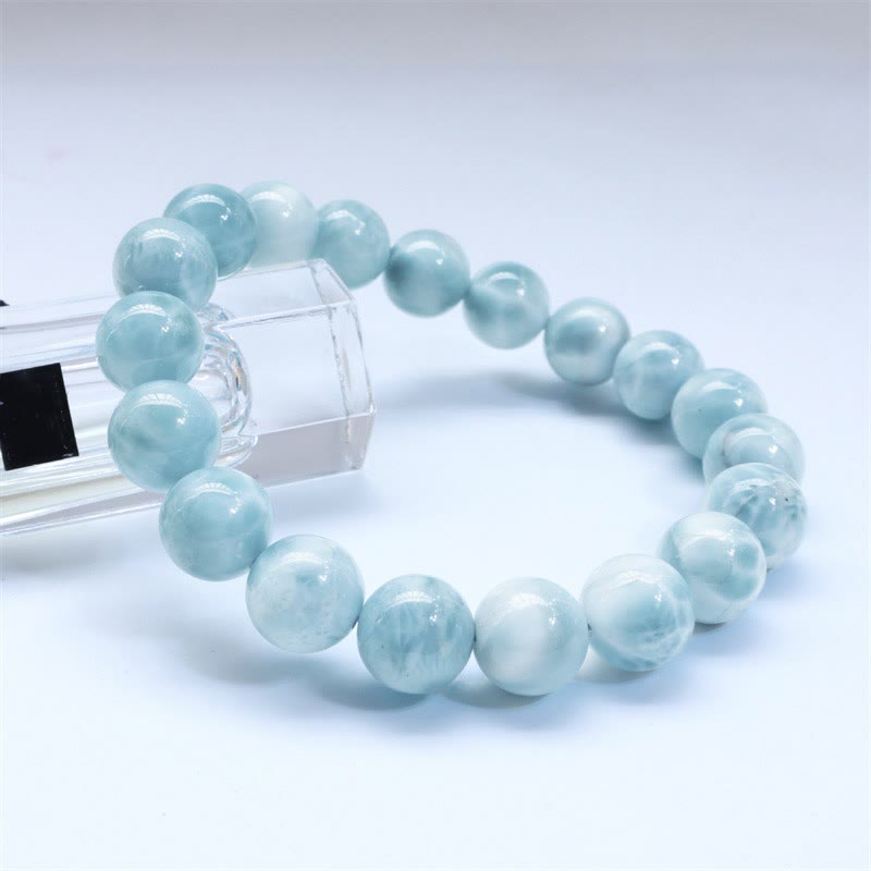 Larimar Armband Weisheit Selbstvertrauen hellblau Naturstein elastisch glänzend.