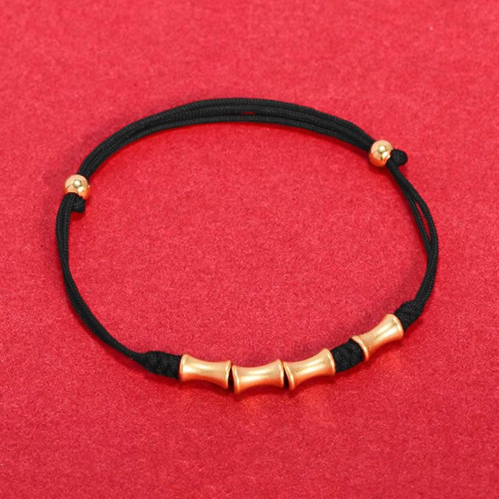 Schwarzes Armband mit Bambus-Perlen goldfarben elastisch Glücksarmband