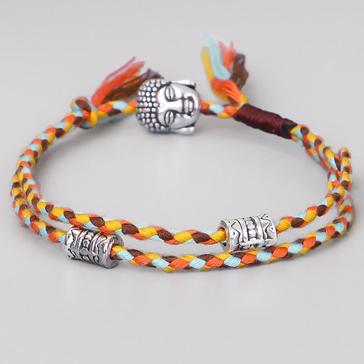 Armband Head Gelassenheit mit buntem Seil und silbernen Perlen.