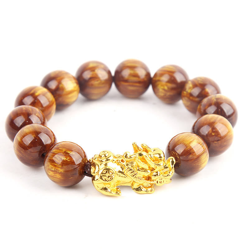 Armband Tigerauge Pixiu Glück braun goldener Verschluss Nahaufnahme Flat Lay