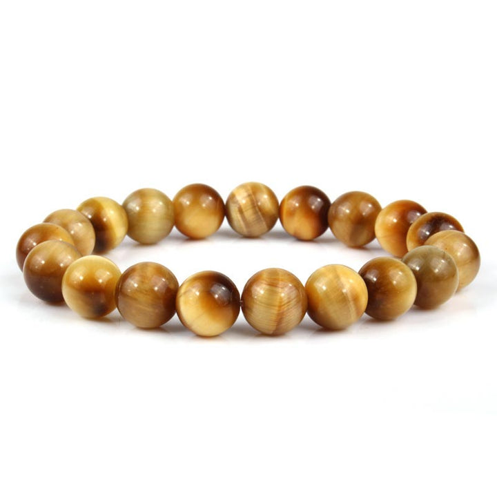 Armband Tigerauge Kristall – Heilung braune Perlen Nahaufnahme Flachlage