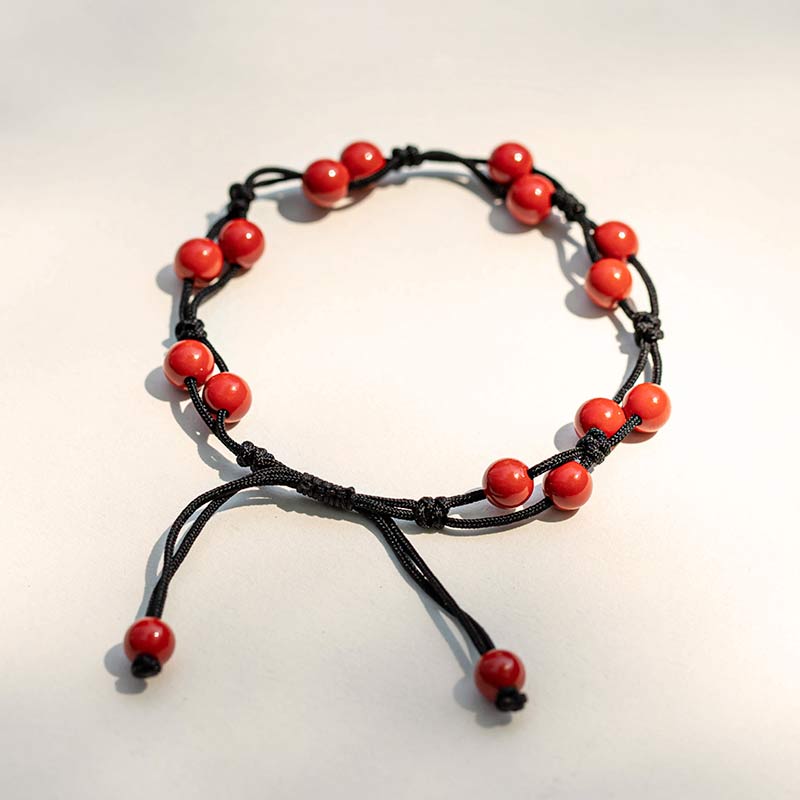 Armband Roter Achat Zinnober mit schwarzem Seil elastisch verstellbar.