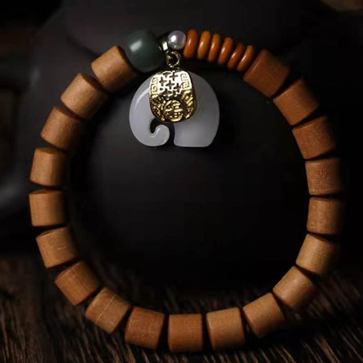 Armband Sandelholz Jade Elefant grüner Stein bronzener Anhänger elastisch