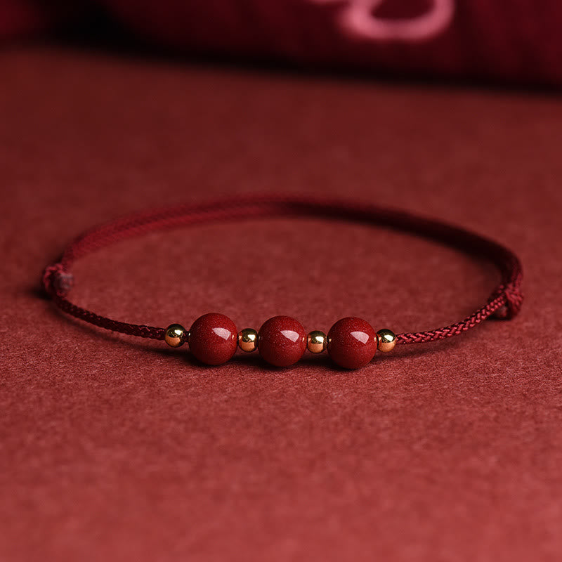 Rotes Armband Zinnober – Glück & Segen mit Perlen auf Stoff