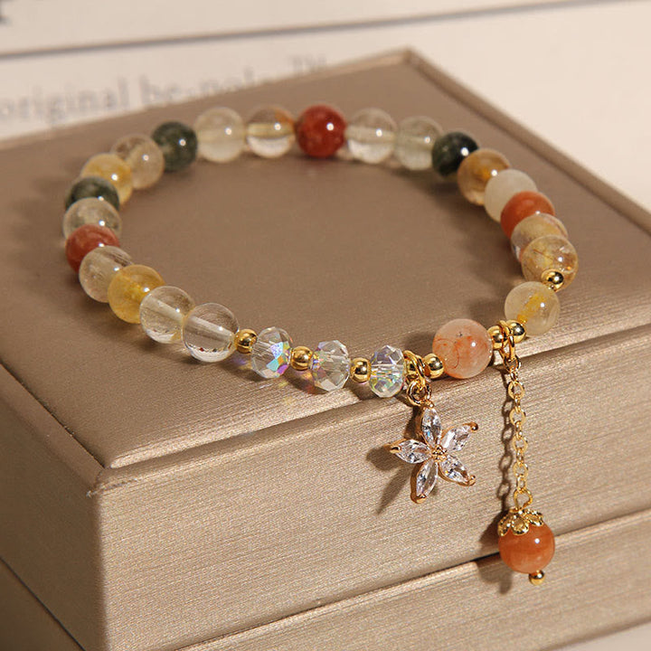 Buntes Armband mit Rutilquarz, Zircon und Glücksanhänger elegant.