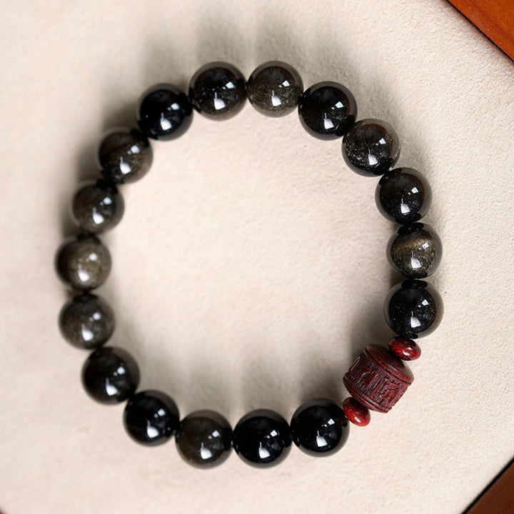 Schwarzes Obsidian Armband mit rotem Om Mani Padme Hum Anhänger elastisch