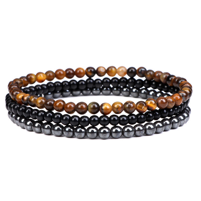 Armband Kristall – Frieden mit Tigerauge und schwarzen Perlen elastisch