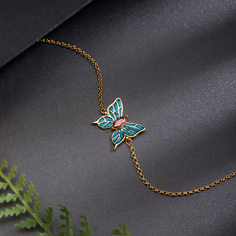 Goldenes Armband mit türkisem Schmetterling Anhänger Schmuck.