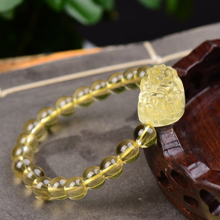 Armband Citrin Pixiu – Wohlstand mit gelbem Stein Flachlage Holz