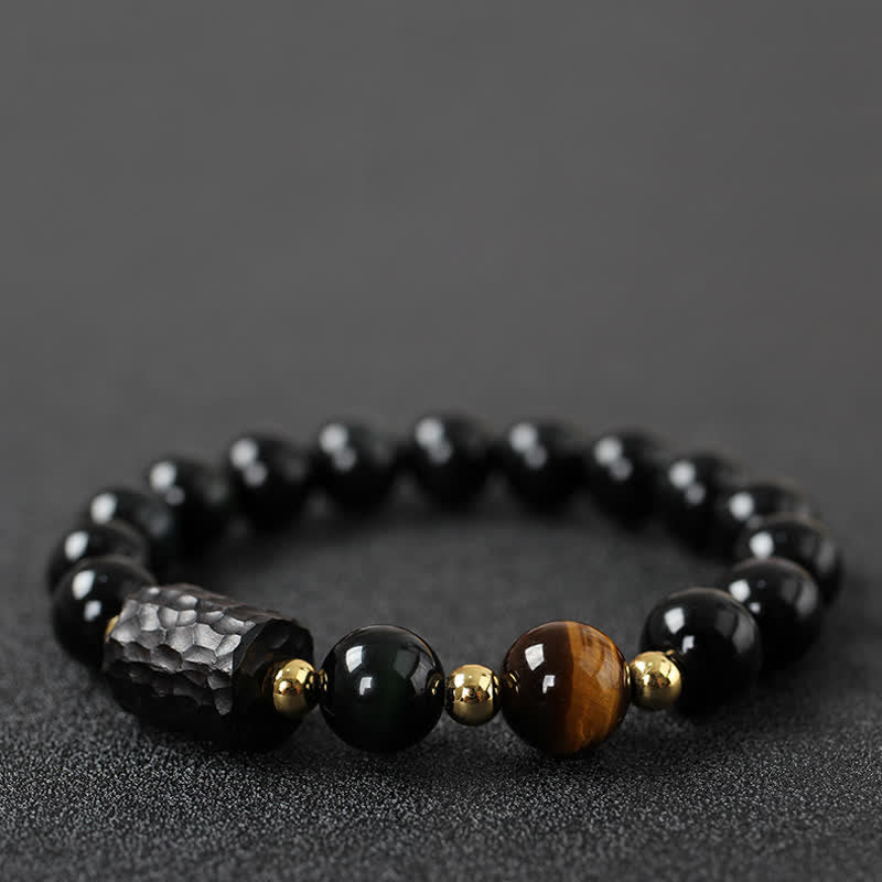 Schwarzer Obsidian Tigerauge Armband mit goldenen Perlen elastisch.