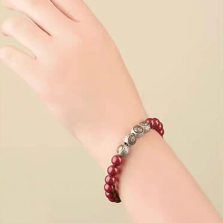 Zinnober Armband 925 Silber elastisch am Handgelenk getragen rote Perlen