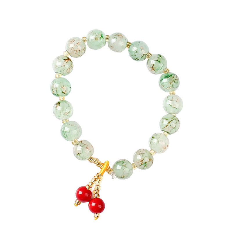 Grünes Jade Armband mit roten Perlen Anhängern Naturstein elastisch