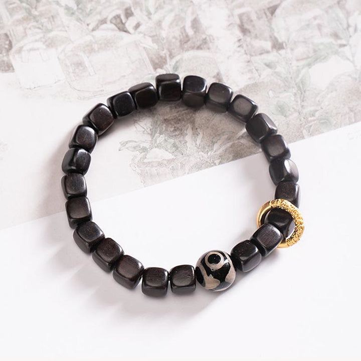 Armband Ebenholz schwarze Perlen goldener Akzent Balance Ruhe