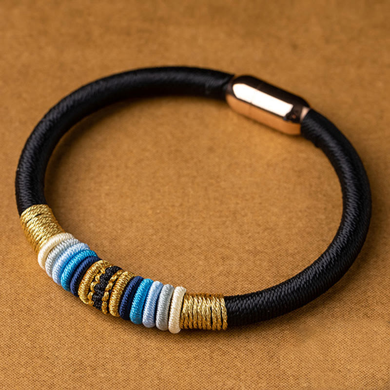 Schwarzes elastisches Armband mit goldenen und blauen Perlen Magnetisch