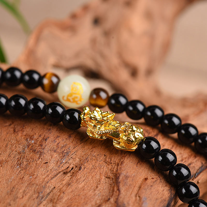 Obsidian Armband Chinesisches Tierkreis Pixiu goldener Charm schwarze Perlen Schutz.