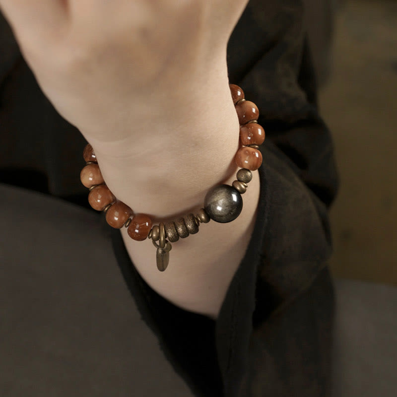 Armband Tigerauge Obsidian – Glück & Wohlstand am Handgelenk getragen braun silber