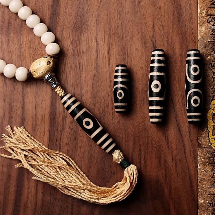 Mala Achat Bodhi Wohlstand Perlenarmband mit Quasten Dekoration.