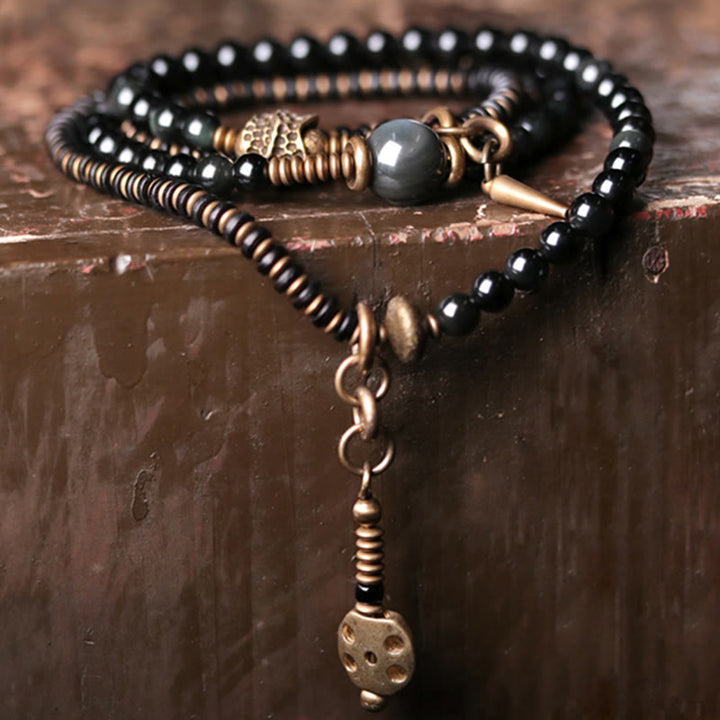Armband Obsidian Kupfer mit schwarzen Perlen und Bronzeverschluss elegant.