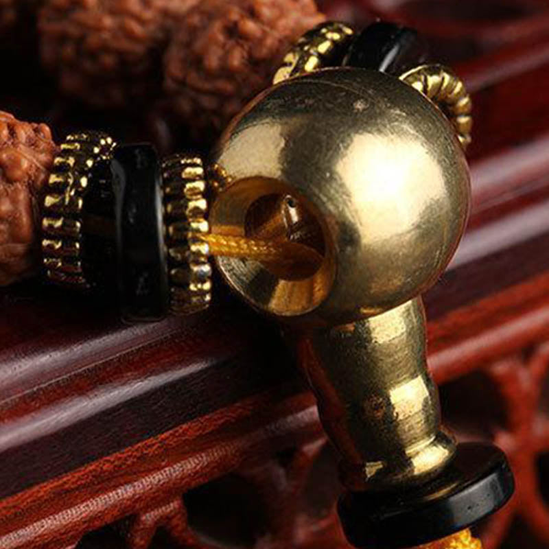 Mala Bodhi Glück Wohlstand Energie Armband goldene Perlen schwarzes Lederband