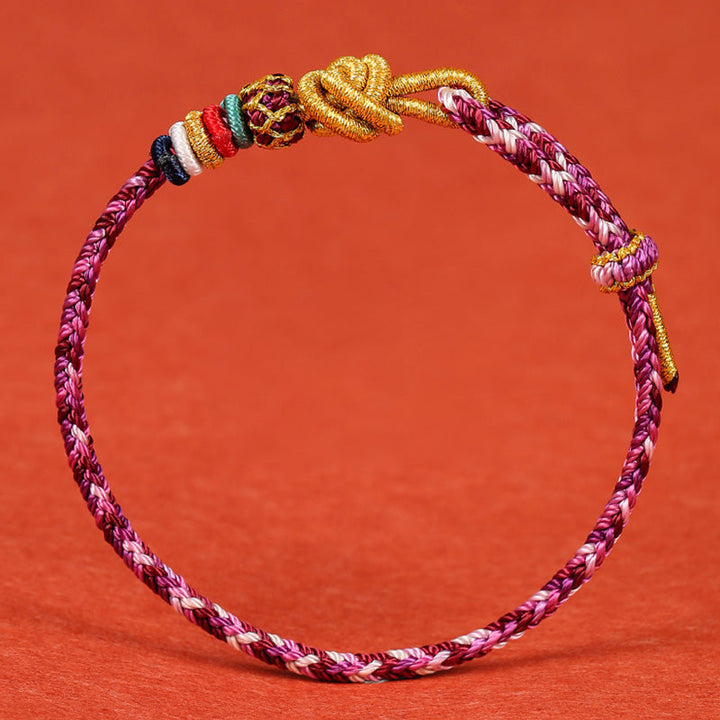 Buntes geflochtenes Armband Dunhuang mit goldenen Knoten Schutz