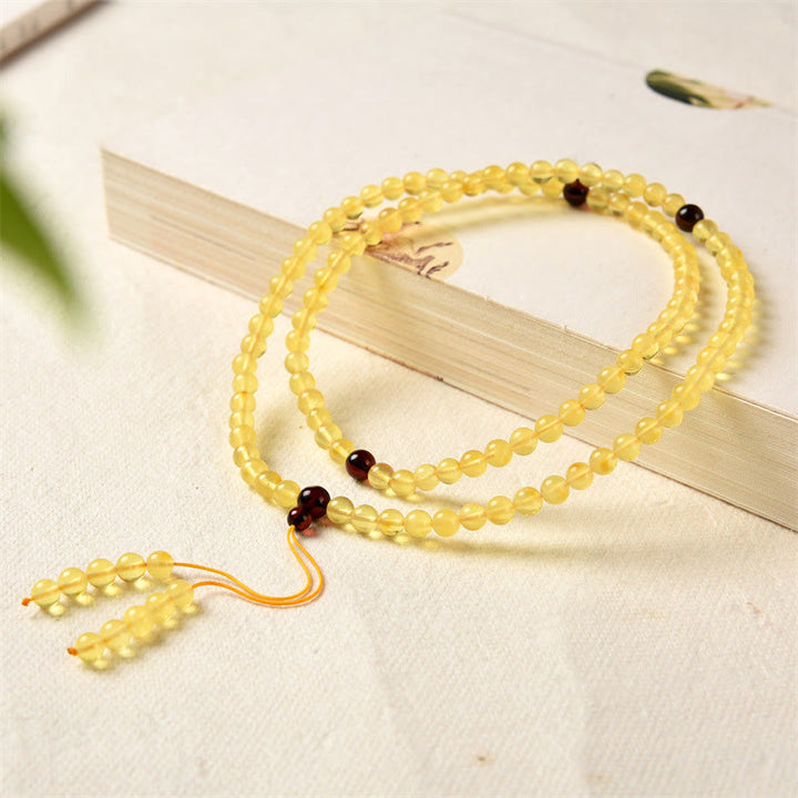 Gelbe Bernstein Mala 108 Perlen Armband mit braunen Akzentperlen Quaste
