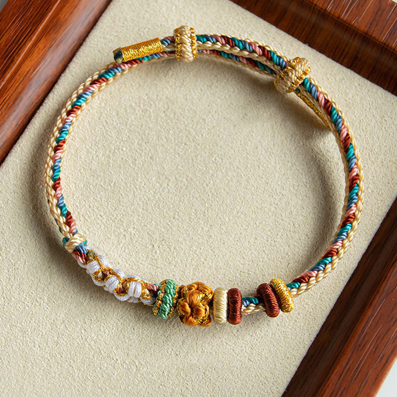 Buntes Armband Pfirsichblüte mit goldenen Perlen elastisch tragbar.
