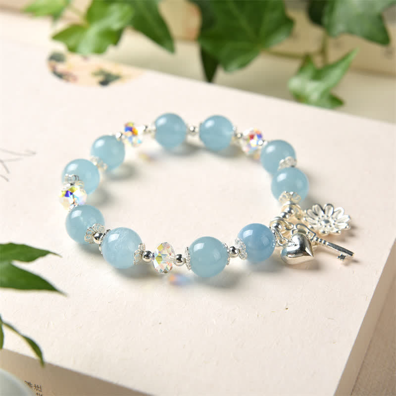 Aquamarin Armband 925 Silber mit Herzanhänger und Blütendetail elegant.