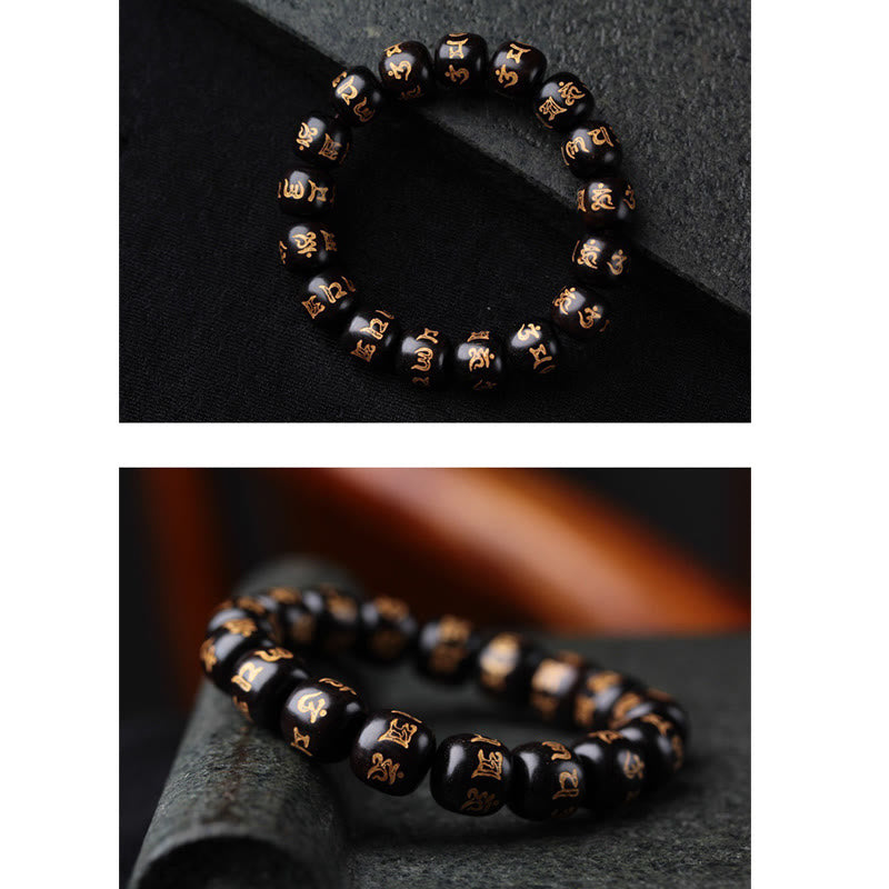 Schwarzes Ebenholz Armband mit Om Mani Padme Hum Symbolen elastisch getragen