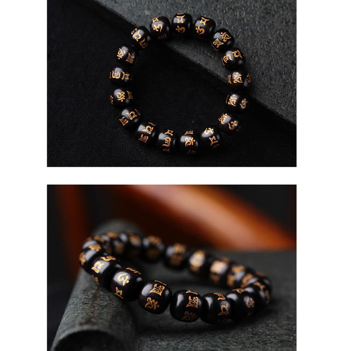 Schwarzes Ebenholz Armband mit Om Mani Padme Hum Symbolen elastisch getragen