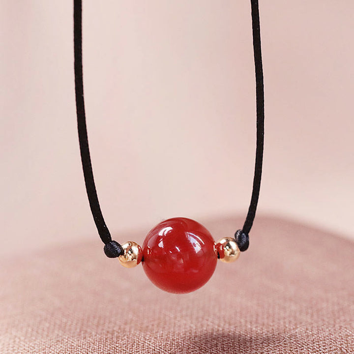 Armband Roter Achat – Balance mit schwarzem Seidenfaden elegant