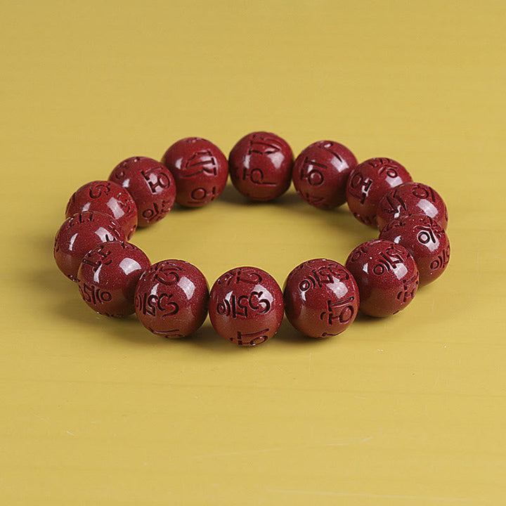 Zinnober Armband mit Om Mani Padme Hum Gravur, rote Perlen Glück Wohlstand