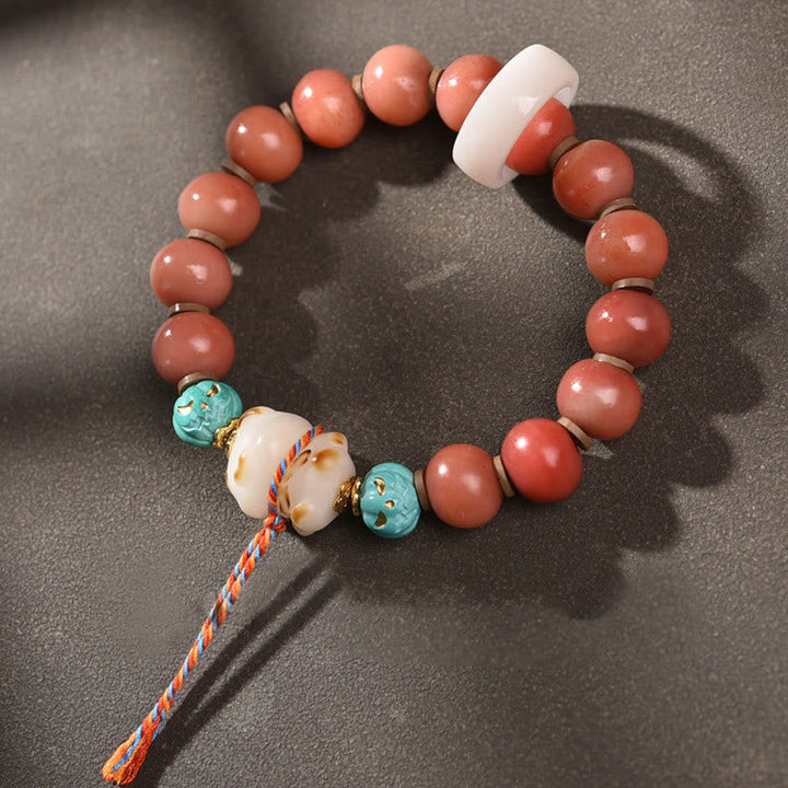 Bodhi Armband mit roten Perlen und Türkis Glück Accessoire