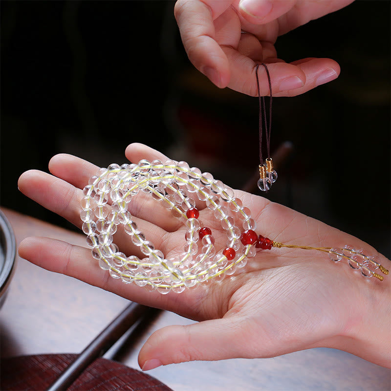 Mala Armband mit klarem Kristall und roten Achat Perlen elegant.