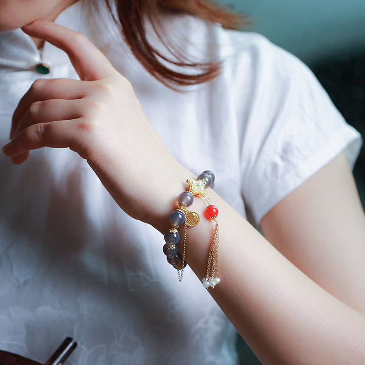 Armband Achat Perle Fu-Zeichen Balance am Handgelenk getragen elegant